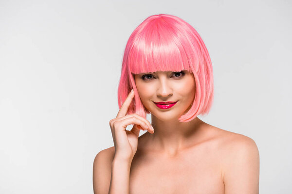 stylish naked girl in pink wig isolated on grey