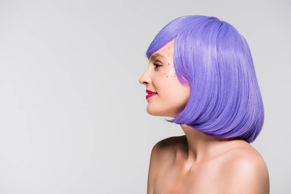 attractive naked girl in purple wig isolated on grey