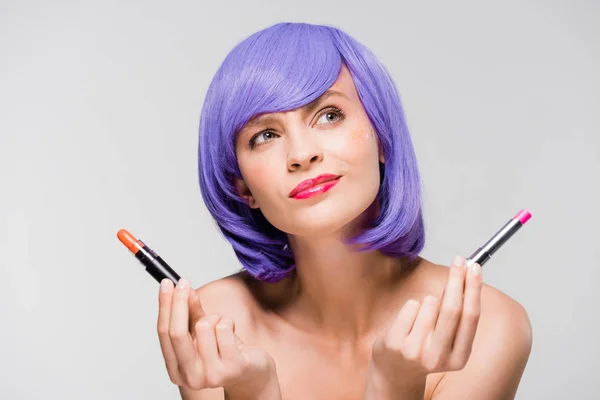 Attractive Thoughtful Girl Purple Wig Holding Lipstick Isolated Grey — Stock Photo, Image