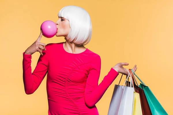 Cheerful Girl White Wig Shopping Bags Bubble Gum Isolated Yellow — Stock Photo, Image