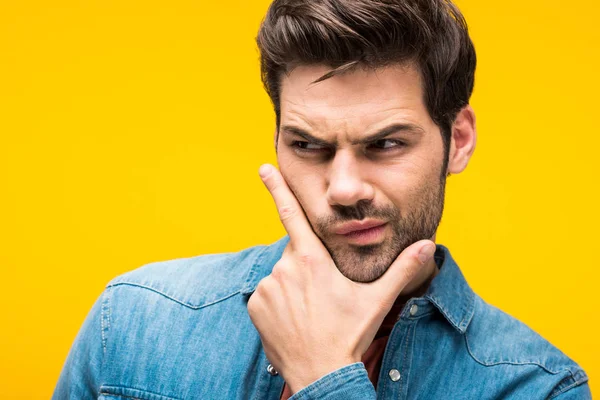 Confused Handsome Man Touching Chin Isolated Yellow — Stock Photo, Image
