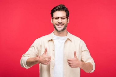 happy handsome man showing thumbs up Isolated On pink clipart