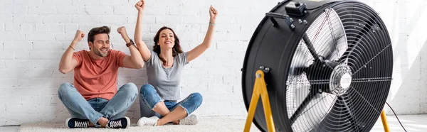 Panoramic Shot Excited Man Woman Sitting Floor Raised Hands Front — Stock Photo, Image