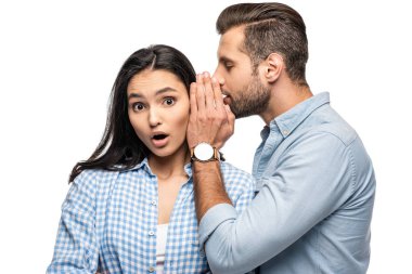 man telling secret to shocked young woman Isolated On White clipart