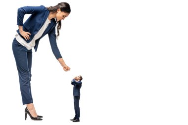 big businesswoman showing clenched fist at small businessman Isolated On White clipart