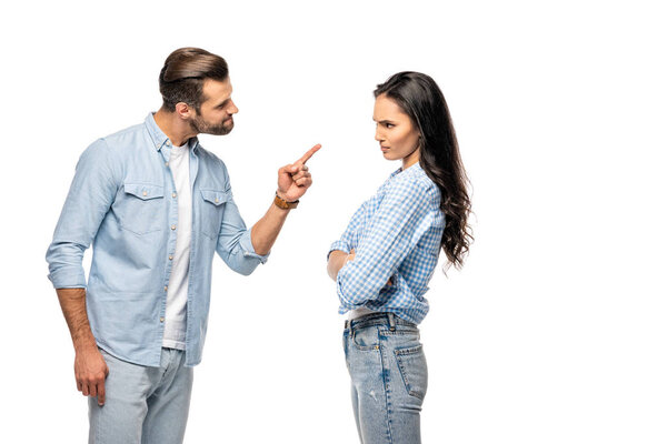 angry man pointing with finger at young woman Isolated On White