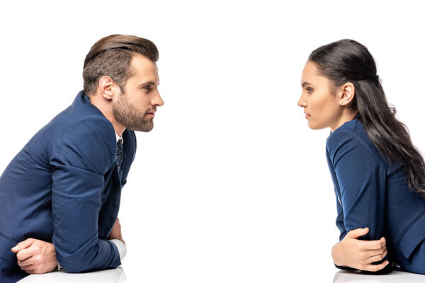 businessman and businesswoman in formal wear Looking At Each Other isolated on white