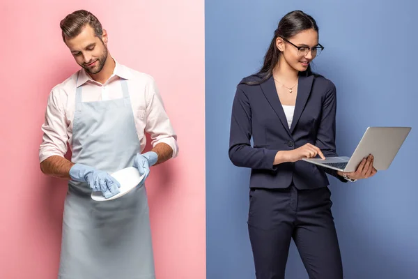男子在围裙洗盘 而女商人使用笔记本电脑的蓝色和粉红色 — 图库照片