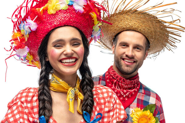 happy man and young woman in festive clothes looking at camera isolated on white