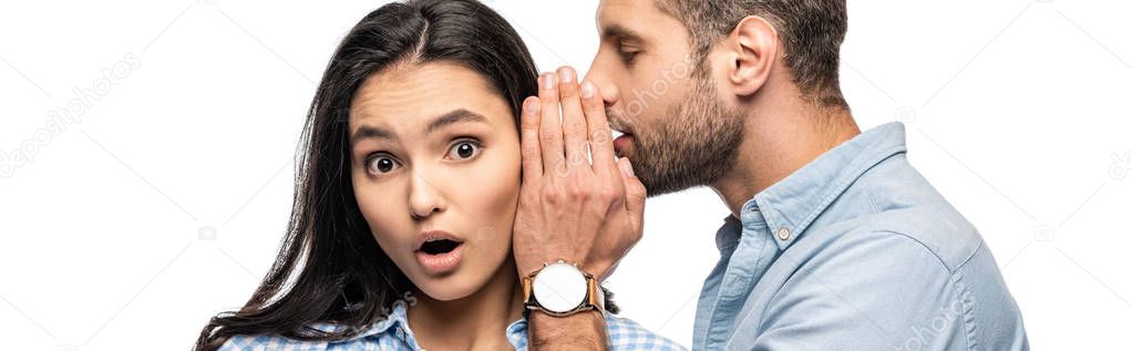 panoramic shot of man telling secret to shocked young woman Isolated On White