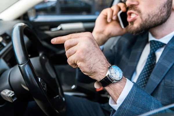 Selective Focus Angry Bearded Businessman Talking Smartphone Pointing Finger Car — Stock Photo, Image