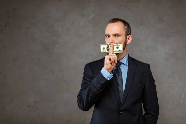 Businessman Covering Mouth Dollar Banknote While Standing Grey — Stock Photo, Image
