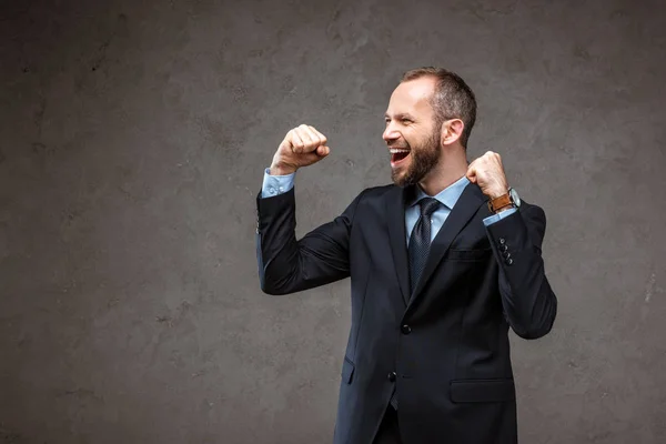 Happy Bearded Businessman Suit Gesturing While Celebrating Grey — Stock Photo, Image