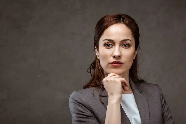 Thoughtful Brunette Businesswoman Formal Wear Looking Camera Grey — Stock Photo, Image