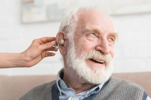 Happy Grey Haired Man Hearing Aid Looking Away — Stock Photo, Image