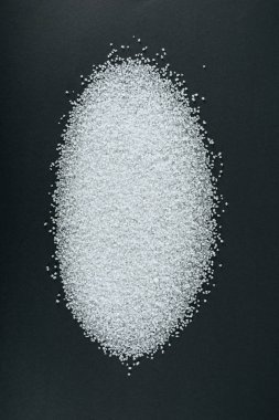 top view of sweet white sugar crystals on black background clipart