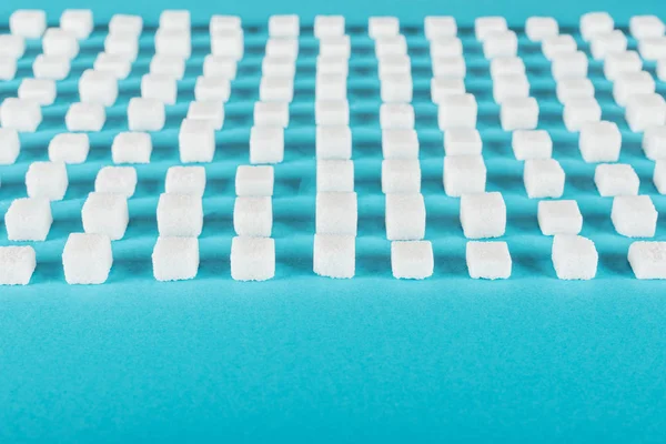 White Sugar Blue Surface Arranged Horizontal Rows — Stock Photo, Image