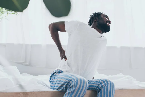 Selective Focus Young African American Man Suffering Back Pain Bedroom — Stock Photo, Image