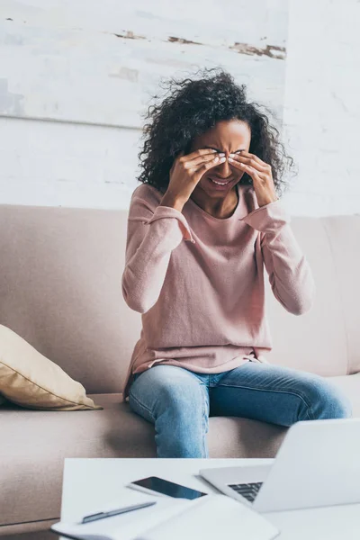 Exhausted African American Woman Suffering Headache While Sitting Sofa Table — Stock Photo, Image