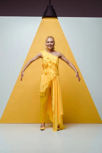 Cheerful Blonde Girl Smiling While Posing Gesturing White Yellow — Stock Photo, Image