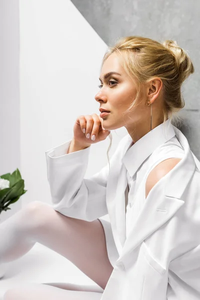 Dreamy Young Blonde Woman Sitting White Grey — Stock Photo, Image