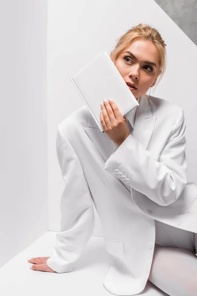 Blonde Woman Holding Blank Notebook White Grey — Stock Photo, Image