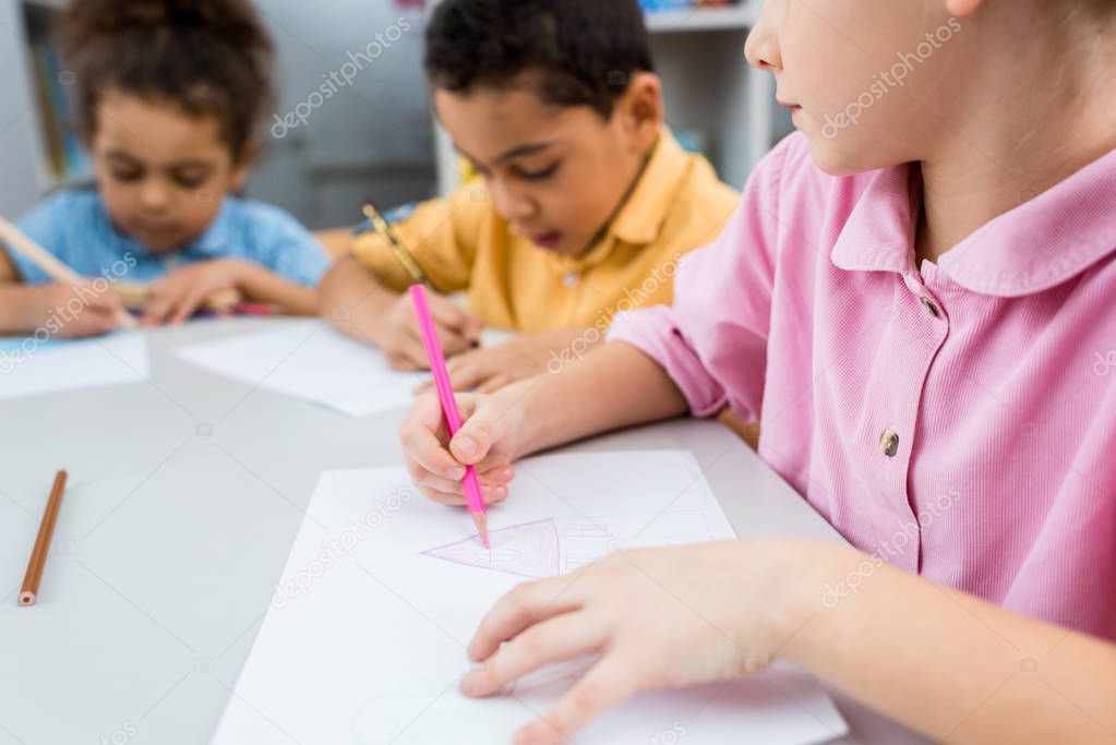 selective focus of kid drawing near cute african american children 