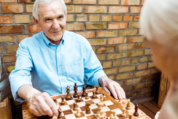 Selective Focus Cheerful Retired Man Playing Chess Senior Wife — Stock Photo, Image