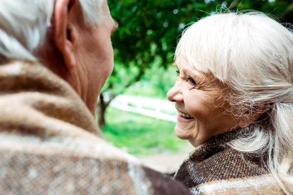 Selective Focus Happy Senior Woman Plaid Blanket Looking Husband — Stock Photo, Image