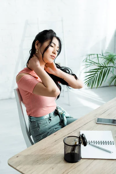 Attractive Asian Woman Closed Eyes Sitting Table — Stock Photo, Image