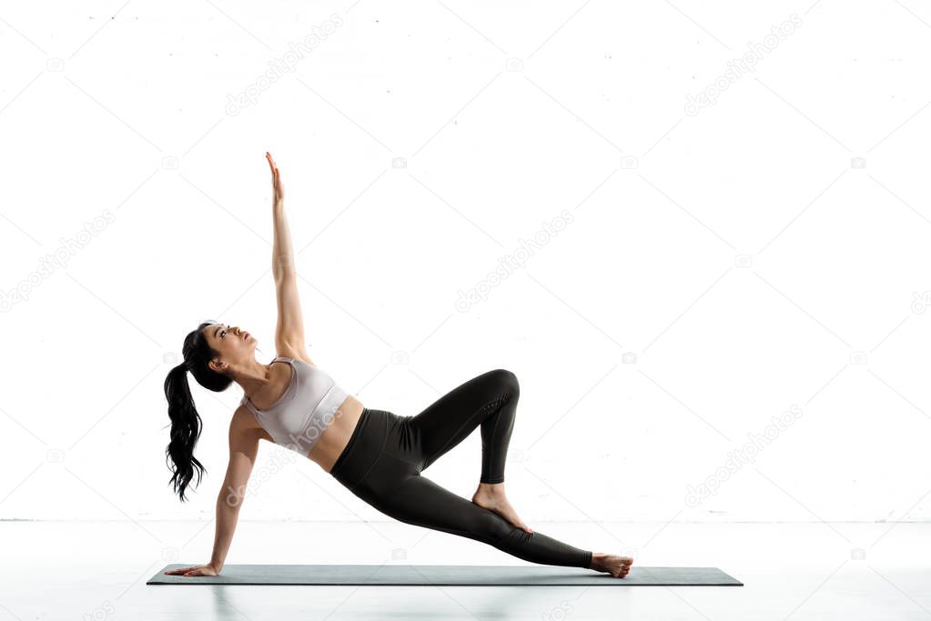 asian woman with barefoot doing exercise on white