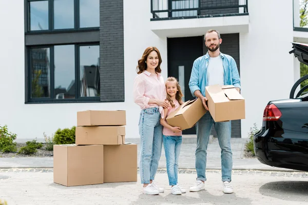 Cheerful Family Standing Boxes While Moving Modern House — Stock Photo, Image