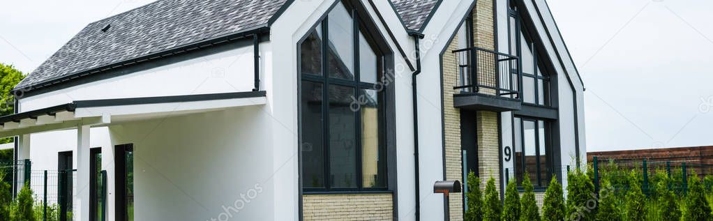 panoramic shot of new modern and luxury home with windows