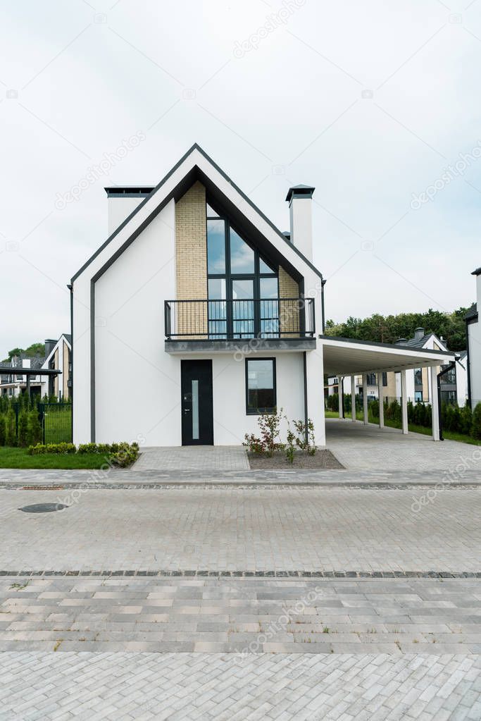 green grass and plants near new modern and luxury home 