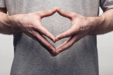 vücut dilini kullanarak ve gri, insan duygu ve ifade kavramı izole çan kulesi jest gösteren adam kırpılmış görünümü