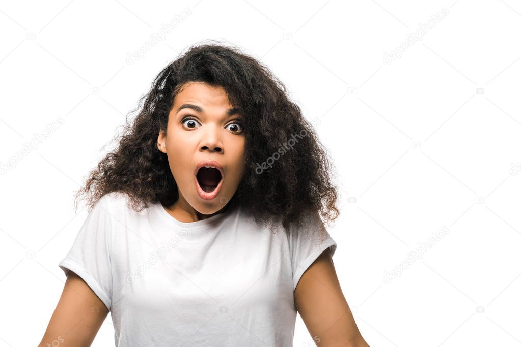 shocked african american woman looking at camera isolated on white 