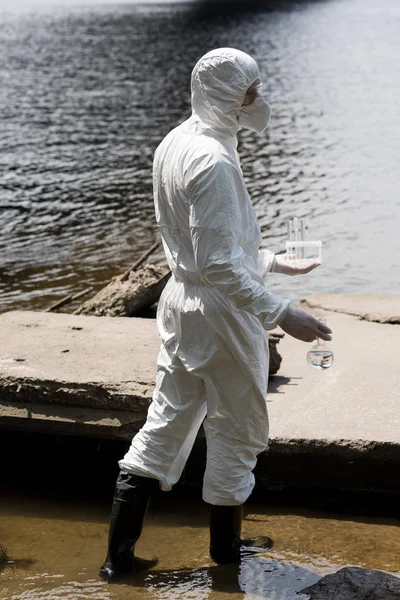 Side View Water Inspector Protective Costume Respirator Holding Test Tubes — Stock Photo, Image