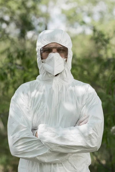 Front View Ecologist Protective Costume Respirator Crossed Arms Forest — Stock Photo, Image