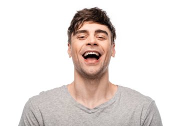 cheerful young man laughing while looking at camera isolated on white clipart