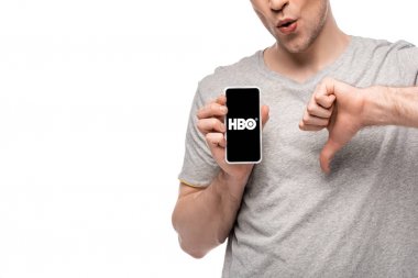 Kiev, Ukrayna - 16 Mayıs 2019: Beyaz izole Hbo uygulaması ile başparmak aşağı ve akıllı telefon gösteren adam kırpılmış görünümü