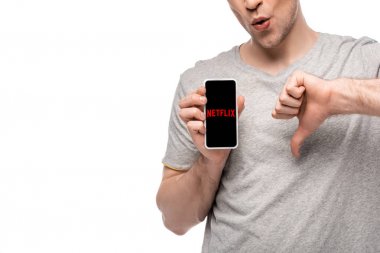 Kiev, Ukrayna - 16 Mayıs 2019: beyaz izole netflix uygulaması ile başparmak aşağı ve akıllı telefon gösteren adam kırpılmış görünümü