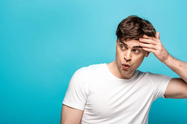 Worried Young Man Looking Away While Holding Hand Head Blue — Stock Photo, Image