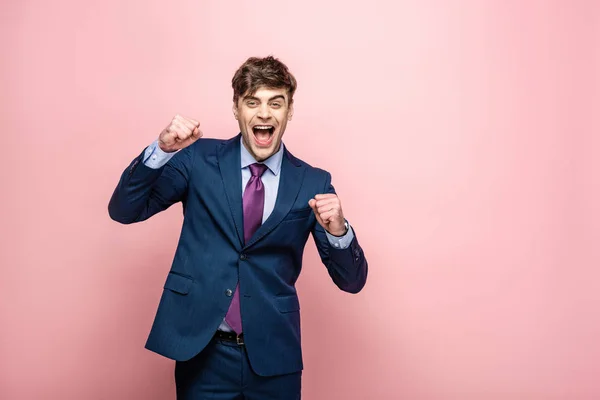 Cheerful Businessman Showing Winner Gesture While Looking Camera Pink Background — Stock Photo, Image