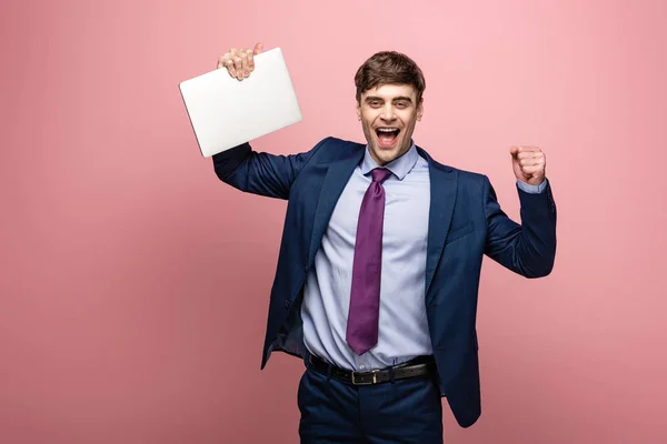 Happy Businessman Smiling Camera While Holding Laptop Showing Winner Gesture — Stock Photo, Image