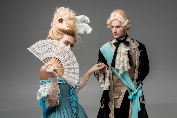 Beautiful Victorian Woman Covering Face Fan While Holding Hands Gentleman — Stock Photo, Image