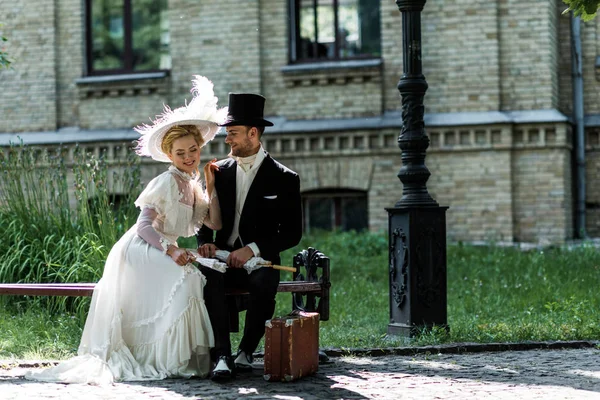 Cheerful Victorian Woman Holding Fan While Sitting Handsome Man Bench — Stock Photo, Image