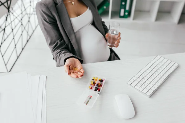 Cropped View Pregnant Woman Holding Pills Glass Water While Sitting — Stock Photo, Image
