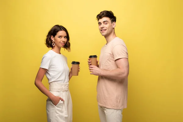 Smiling Man Woman Looking Camera While Holding Coffee Yellow Background — Stock Photo, Image