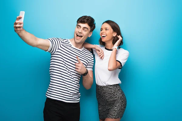 Cheerful Man Taking Selfie Attractive Smiling Girl Blue Background — Stock Photo, Image