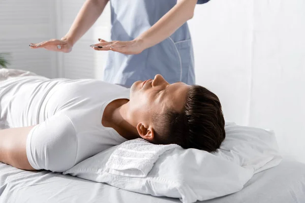 Partial View Healer Standing Man Massage Table Holding Hands His — Stock Photo, Image